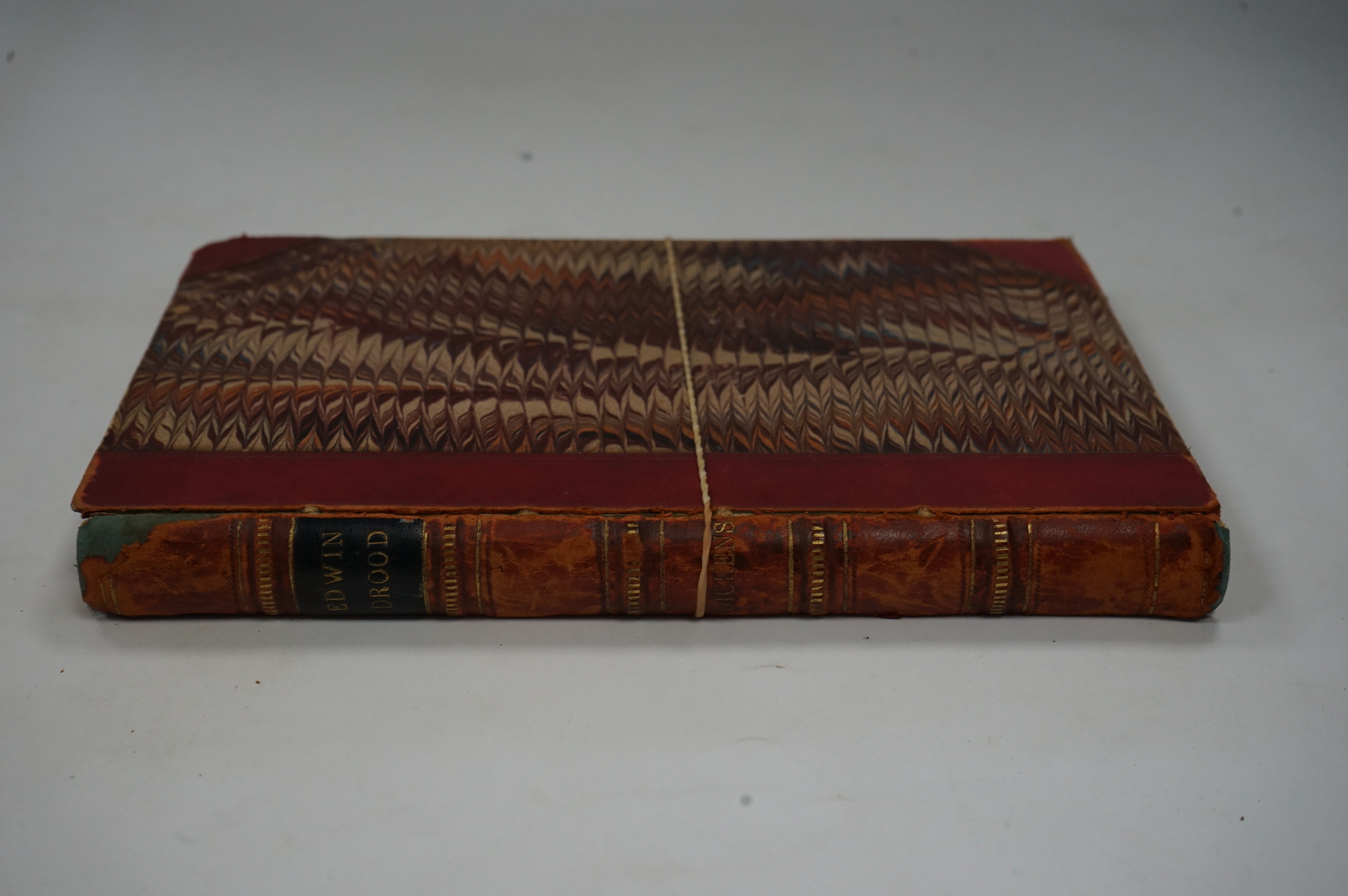 Dickens, Charles - The Mystery of Edwin Drood. First Edition. portrait (of the author), pictorial engraved and printed titles, and 12 plates (by S.L. Fildes); old calf and marbled boards, gilt decorated panelled spine wi